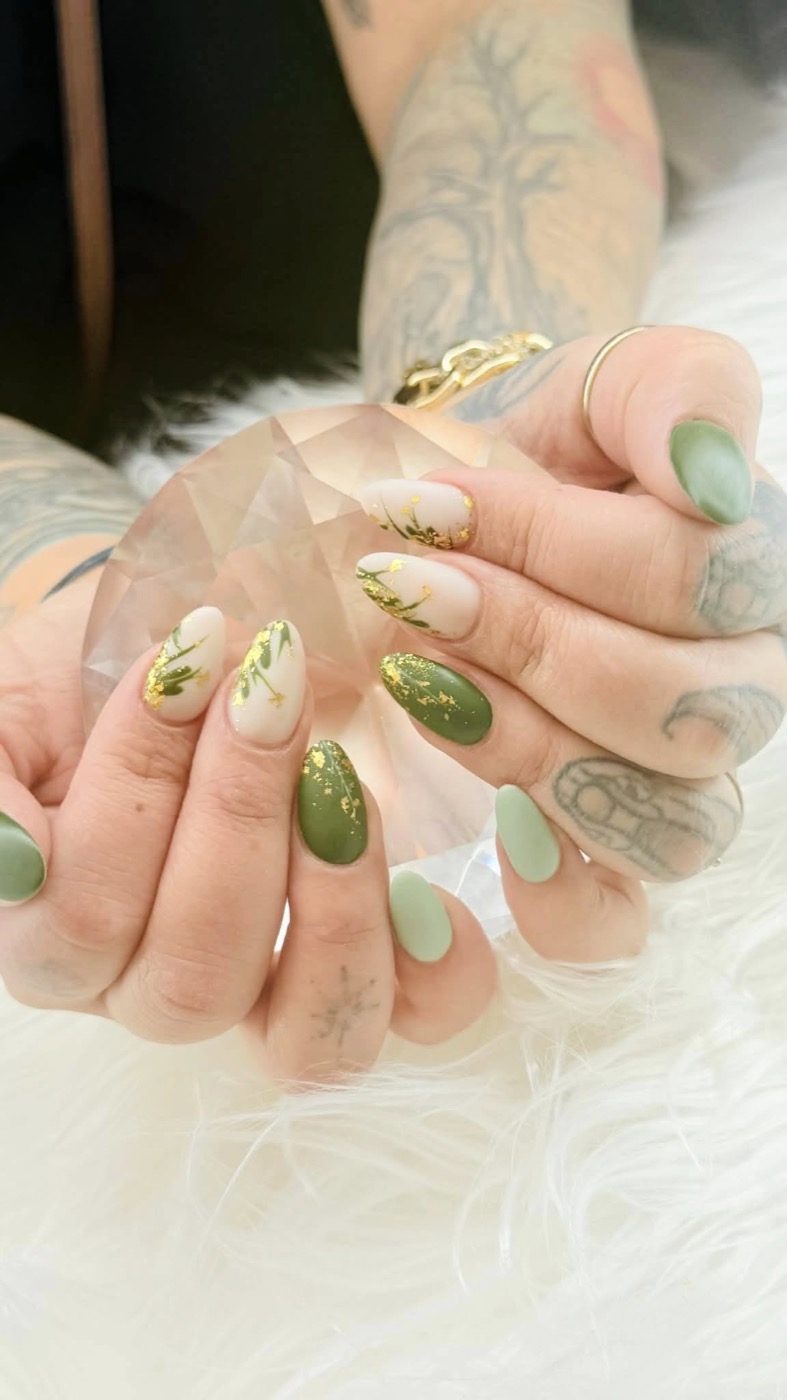 Green and gold botanical nail design